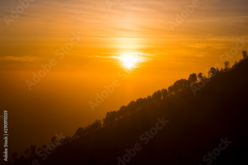 The magnificent views at sunrise from a mountain road trecking to the Ijen volcano or Kawah Ijen