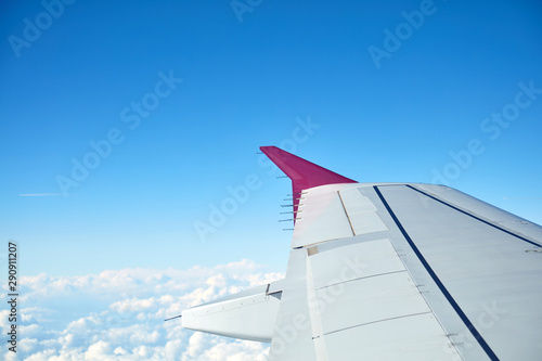 Airplane wing as seen from the passenger s seat.