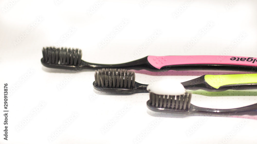 Toothbrush Isolated on white Background. Tooth Brushes Scattered on Table. Collection of Elegant Clear Healthcare Bath Accessory for Clean Teeth Toothbrush Isolated on white Background. Tooth Brushes Scattered on Table. Collection of Elegant Clear Healthcare Bath Accessory for Clean Teeth