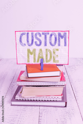 Word writing text Custom Made. Business photo showcasing something is done to order for particular customer organization pile stacked books notebook pin clothespin colored reminder white wooden photo