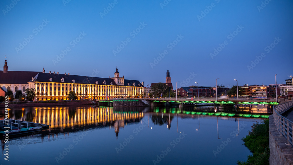 View of University of Wroclaw, Odra River and University Bridge in Wroclaw at sunrise. 