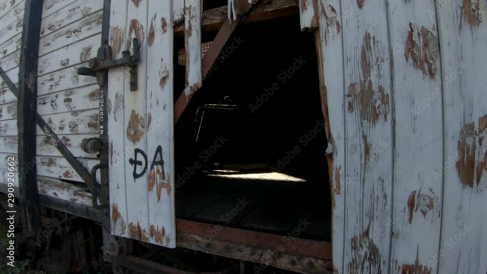 4K Backwards moving from inside railway abandoned wagon