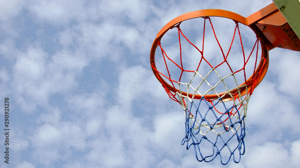 Basketball Hoop and Cloudy Blue Sky. Colorful Sport Equipment. 