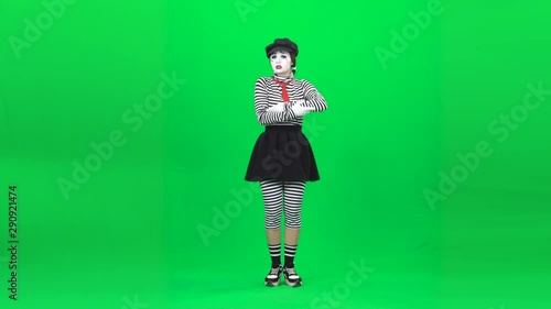 Mime girl shaking baby, looking exhausted. Chroma key. Full length. photo