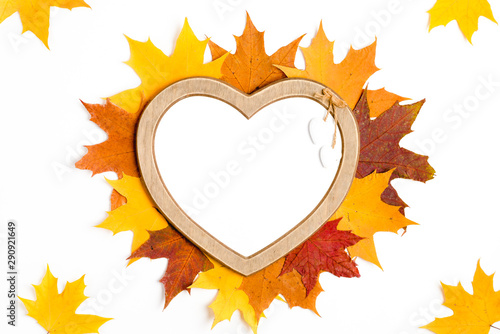 Autumn composition, maple leaves, heart shaped frame, top view, flat lay. Autumn, fall, halloween concept