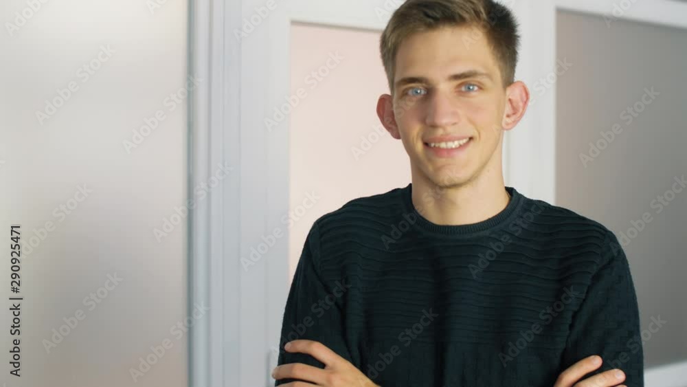 Portrait of young man in office. Happy man in office room and smile. Lifestyle concept. 4k. Slow motion. Portrait of young man in office. Happy man in office room and smile. Lifestyle concept. 4k. Slow motion.