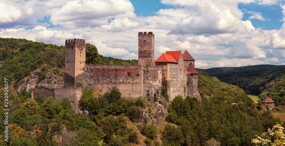 Burg Hardegg - a castle in Lower Austria, Austria. Woodland around, summer day with blue sky with white clouds.
