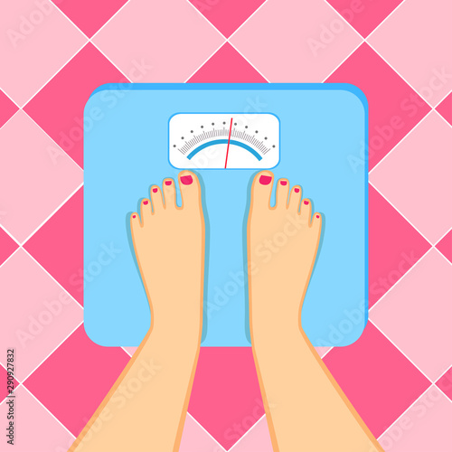 The young woman is weighed on scales.  Female feet with a pedicure  are on an weighing-machine.