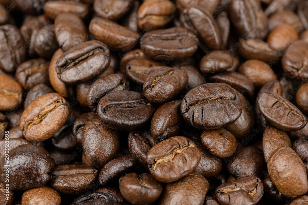 Naklejka premium Roasted coffee beans background, Close Up mixture of different kinds of coffee beans.