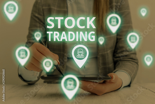 Text sign showing Stock Trading. Business photo text Buy and Sell of Securities Electronically on the Exchange Floor Woman wear formal work suit presenting presentation using smart device photo