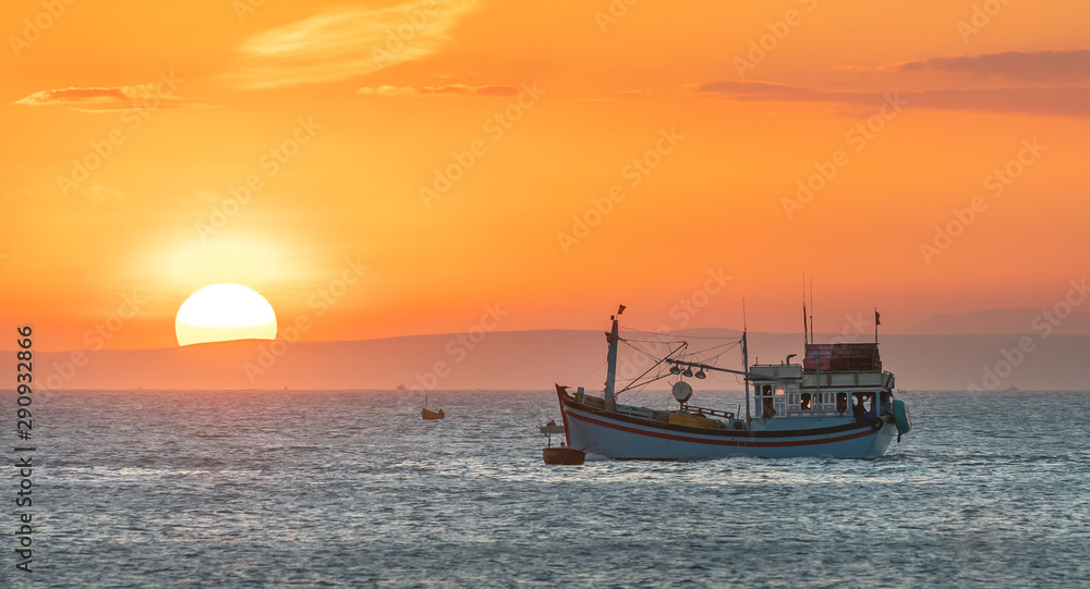 Sea landscape at sunset when fishing boats out to sea to harvest fish end the day.