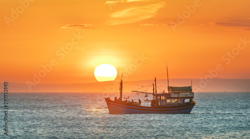 Sea landscape at sunset when fishing boats out to sea to harvest fish end the day.