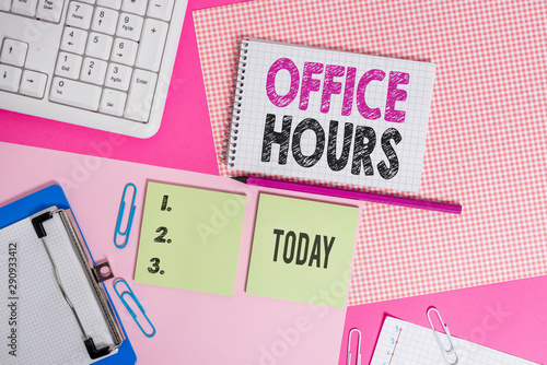 Text sign showing Office Hours. Business photo text The hours which business is normally conducted Working time Writing equipments and computer stuffs placed above colored plain table photo