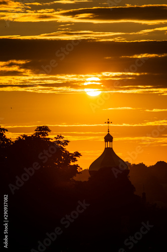 roof of an orthodox church with a cross against the sky