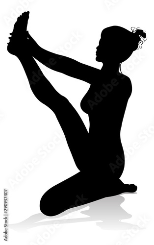 A silhouette of a woman in a yoga or pilates pose