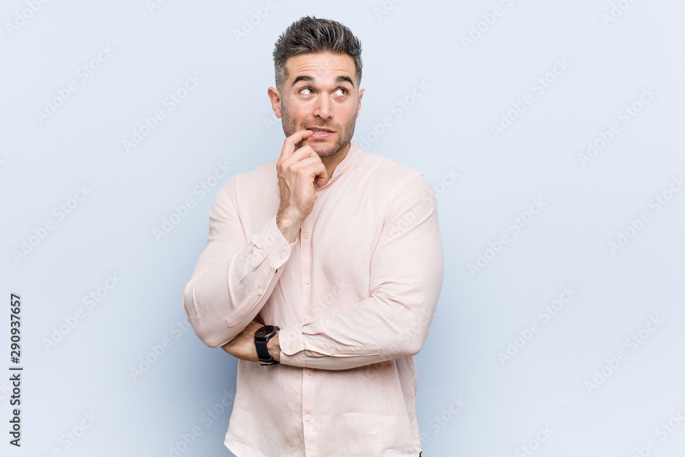 Young handsome cool man relaxed thinking about something looking at a copy space. Young handsome cool man relaxed thinking about something looking at a copy space.