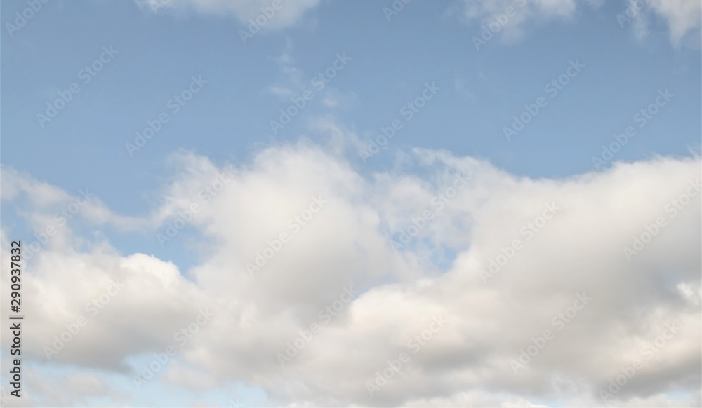 Blue sky with white clouds backgrounds on a sunny day.