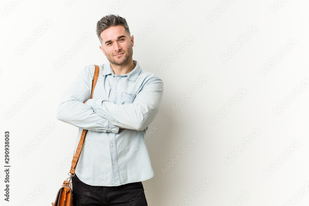 Young handsome business man smiling confident with crossed arms. Young handsome business man smiling confident with crossed arms.