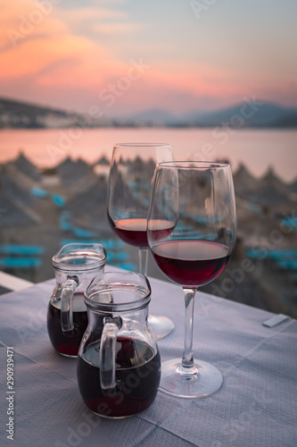 Two glasses of wine on the beach on a desk