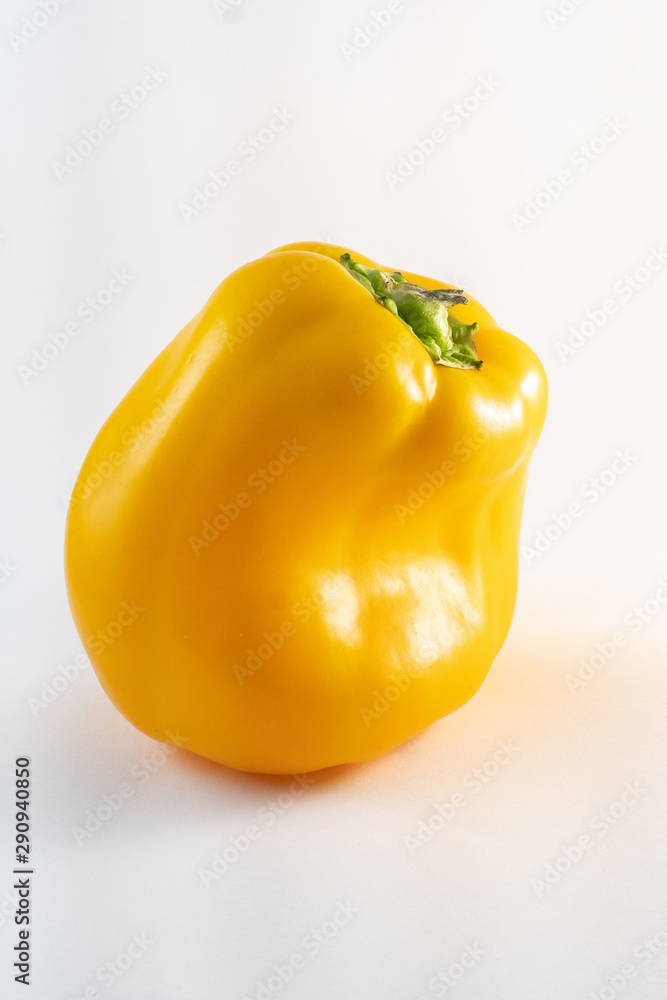 Isolated yellow sweet bell paprika, on bright background Isolated yellow sweet bell paprika, on bright background
