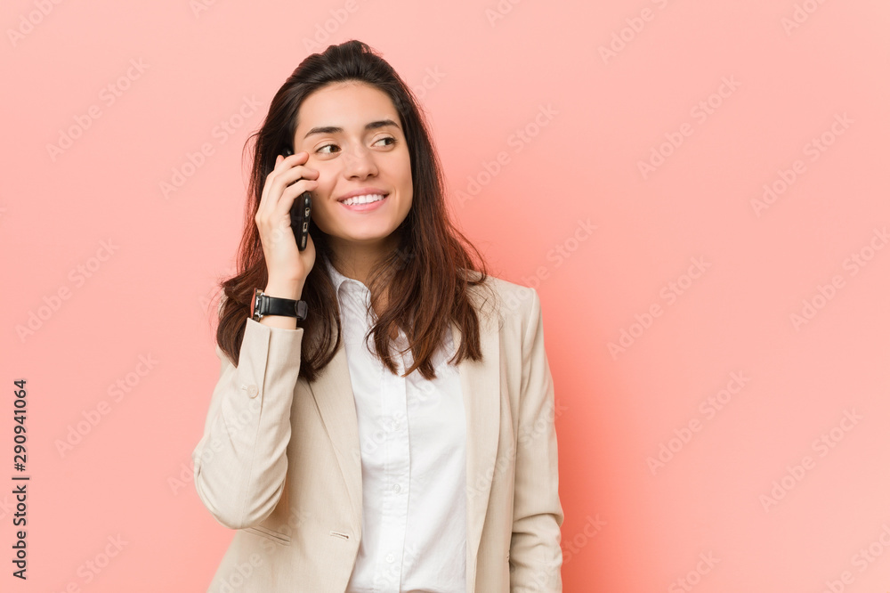 Young caucasian woman talking on the phone Young caucasian woman talking on the phone