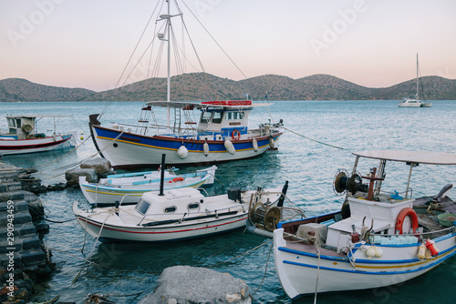 Traditional boats in the harbor of Elounda