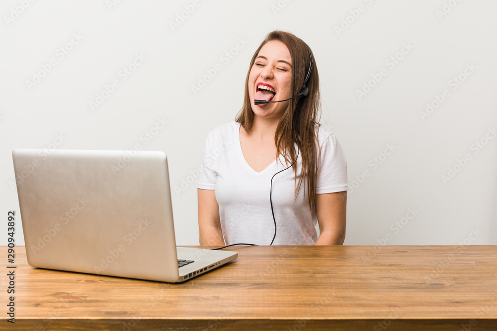 Young telemarketer woman funny and friendly sticking out tongue. Young telemarketer woman funny and friendly sticking out tongue.