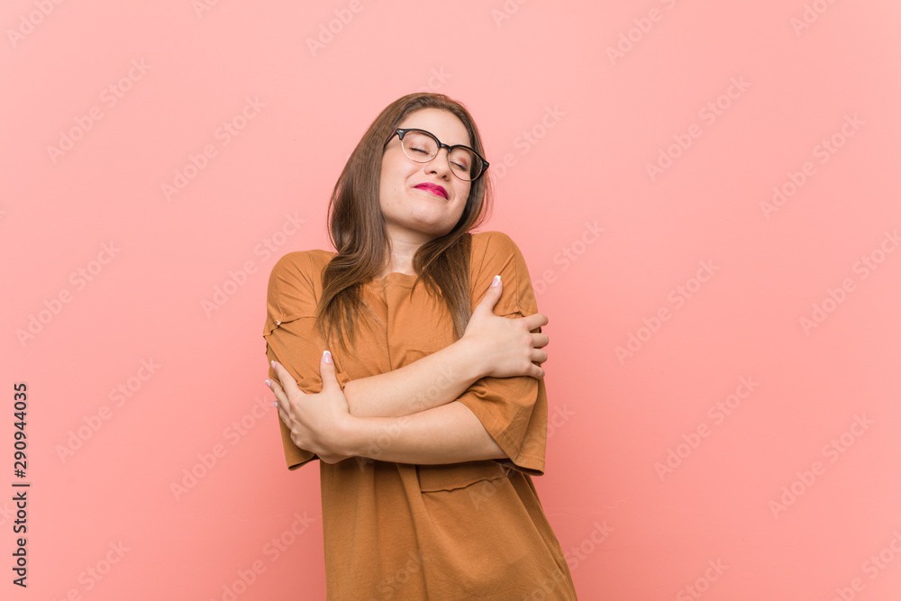 Young student woman wearing eyeglasses hugs, smiling carefree and happy. Young student woman wearing eyeglasses hugs, smiling carefree and happy.