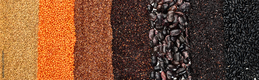 panoramic shot of assorted black beans, rice, quinoa, red lentil and buckwheat