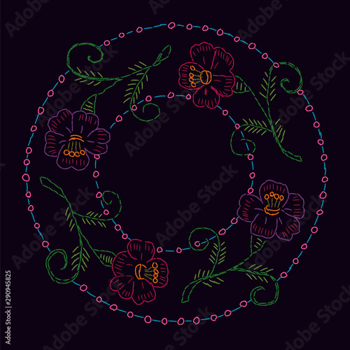 Vector imitation of vintage cross-stitch floral ornament on the black tablecloth