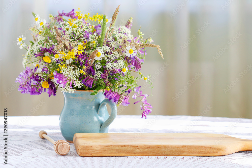 Bouquet of wild flowers on the table. - obrazy, fototapety, plakaty 