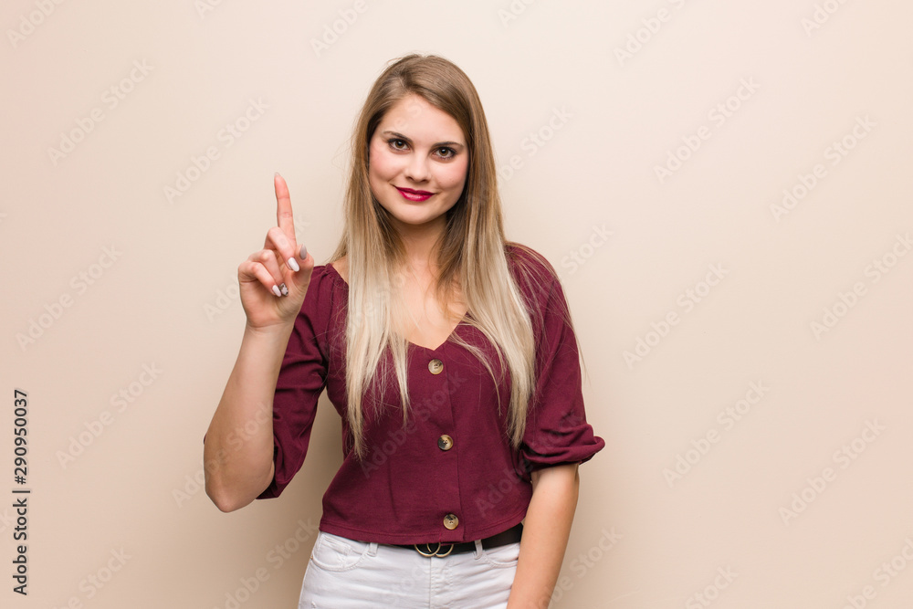 Young russian woman showing number one Young russian woman showing number one