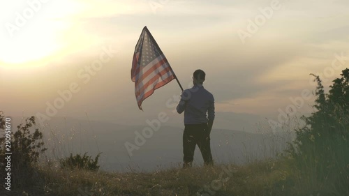 American patriot is holding United States flag photo