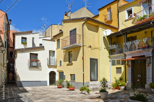 A narrow street between squares  monuments and colorful buildings in the town of Isernia  in Italy