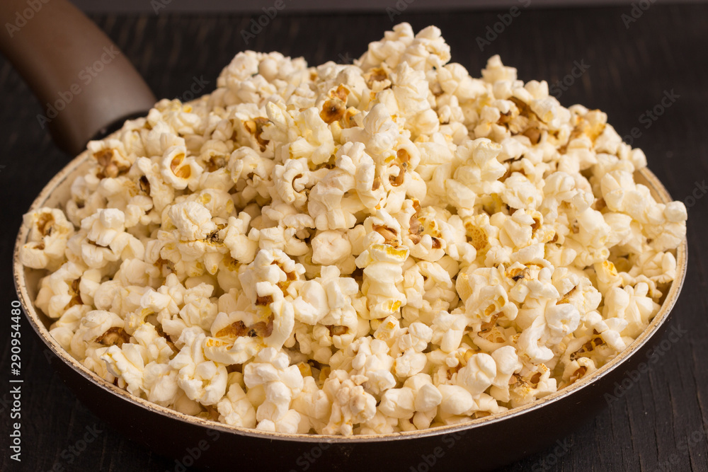 Fried popcorn in a pan, close up Fried popcorn in a pan, close up