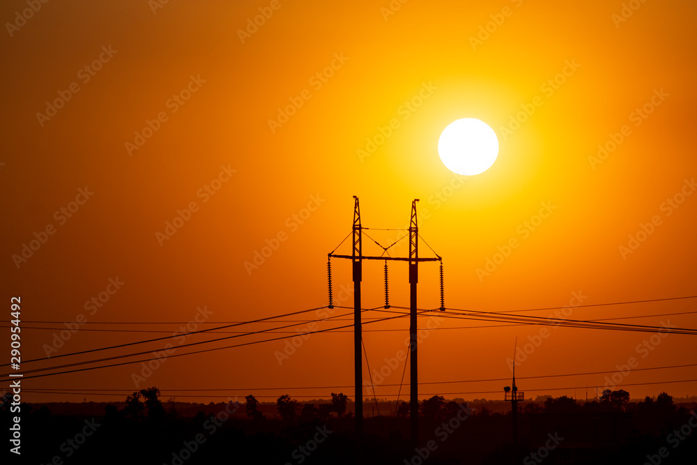 sunset on the background of power lines