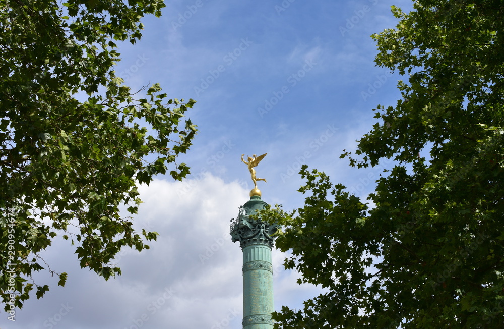 Colonne de Juillet at Place de la Bastille. Gilded statue (Genie de la Liberte) close-up. Paris, France.