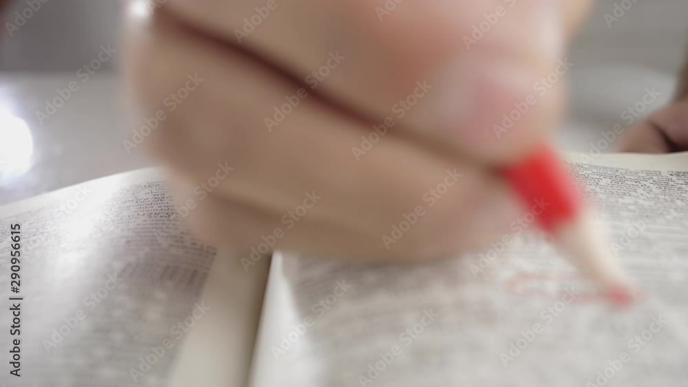 Finds the information. Man finds the information in the reference book. Finds the information. Man finds the information in the reference book.