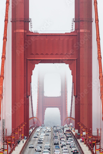 Wallpaper Mural Symmetrical front view of the Golden Gate bridge in a foggy day, with traffic flowing on its lanes Torontodigital.ca
