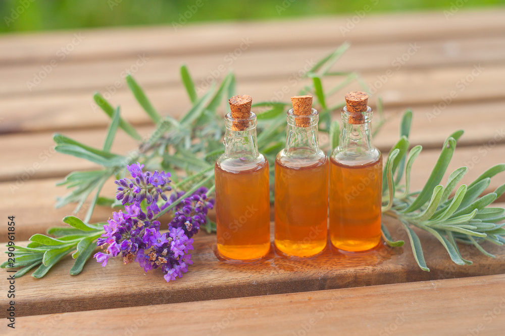 lavender essential oil in beautiful bottle on table lavender essential oil in beautiful bottle on table