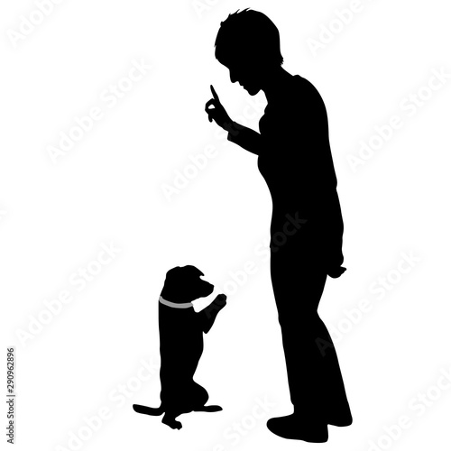 Silhouette of woman and Dog sitting on its hind legs on a white background