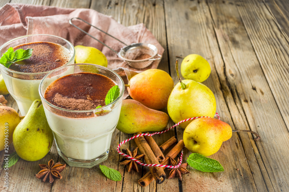Autumn healthy drinks and snacks. Pear smoothie with cocoa chocolate and spices - cinnamon, anise, with mint leaves. On a rustic wooden background, copy space Autumn healthy drinks and snacks. Pear smoothie with cocoa chocolate and spices - cinnamon, anise, with mint leaves. On a rustic wooden background, copy space