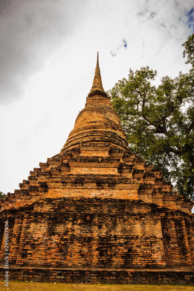 Fototapeta premium Wat Mahathat Temple in the precinct of Sukhothai Historical Park, Wat Mahathat Temple is UNESCO World Heritage Site, Thailand.