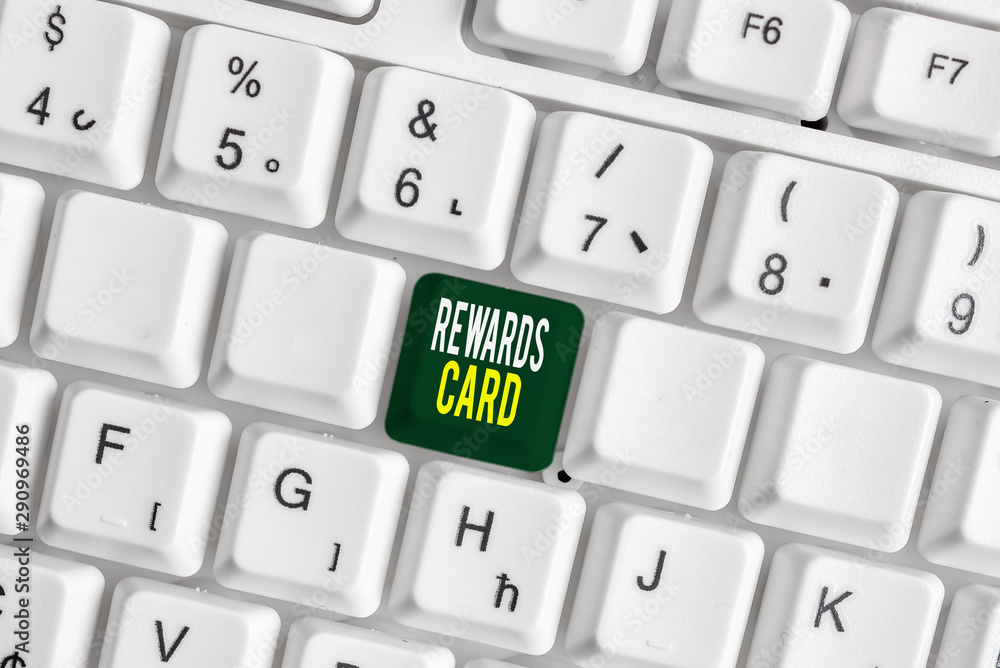 Handwriting text Rewards Card. Conceptual photo Help earn cash points miles from everyday purchase Incentives White pc keyboard with empty note paper above white background key copy space Handwriting text Rewards Card. Conceptual photo Help earn cash points miles from everyday purchase Incentives White pc keyboard with empty note paper above white background key copy space