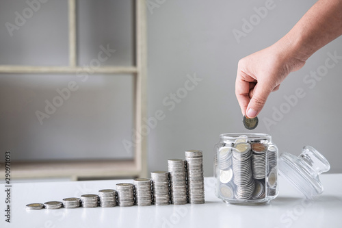 Images of growing stacking coins and Hand putting coin into glass bottle (money box) for planning step up and savings, Saving money for future plan and retirement fund concept