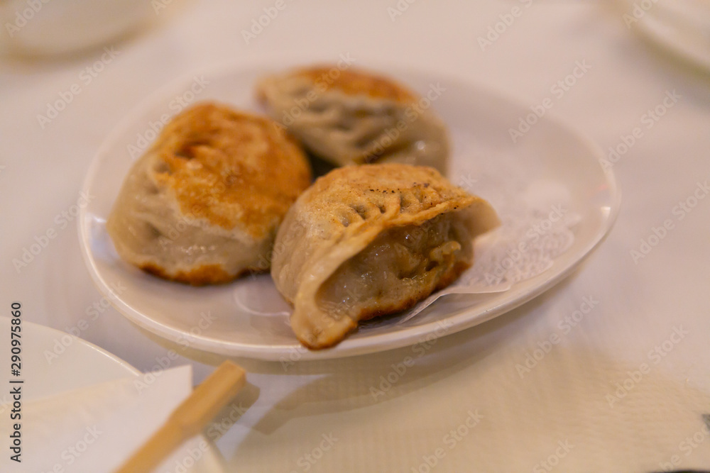 Pork pan fried dumplings at dim sum restaurant Pork pan fried dumplings at dim sum restaurant