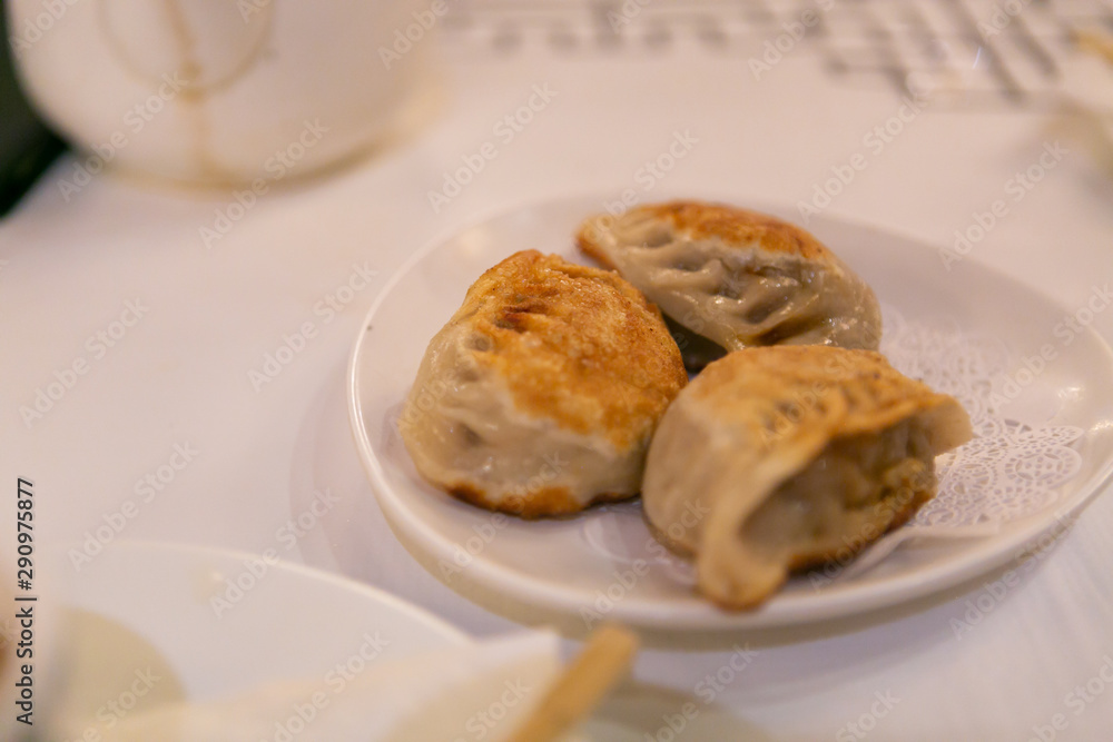 Pork pan fried dumplings at dim sum restaurant Pork pan fried dumplings at dim sum restaurant