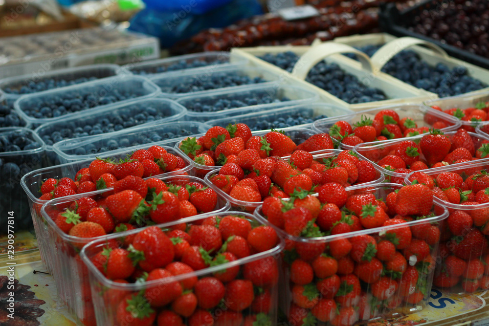 Market. Berries. Selling. Blueberry and strawberry. Raspberries, cherries.