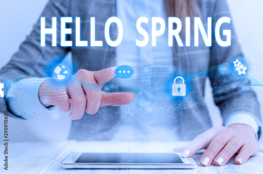 Writing note showing Hello Spring. Business concept for Welcoming the season after the winter Blossoming of flowers Female human wear formal work suit presenting smart device Writing note showing Hello Spring. Business concept for Welcoming the season after the winter Blossoming of flowers Female human wear formal work suit presenting smart device