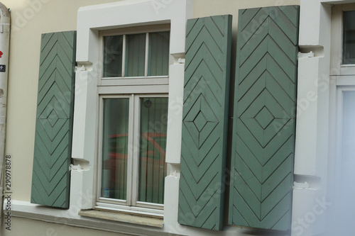 Wooden shutters pastel green. Vilnius Lithuania